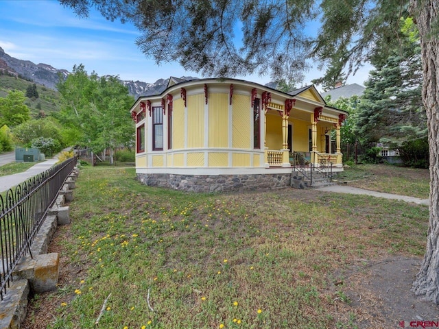 445 4th St, Ouray, CO 81427 - view of front facade featuring covered porch and a mountain view