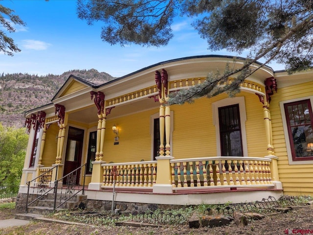 445 4th St, Ouray, CO 81427 - view of front of home with covered porch and a mountain view