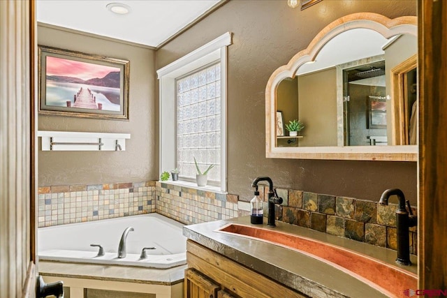 2224 American Way, Montrose, CO 81401 - full bath with a bath, vanity, plenty of natural light, and a textured wall