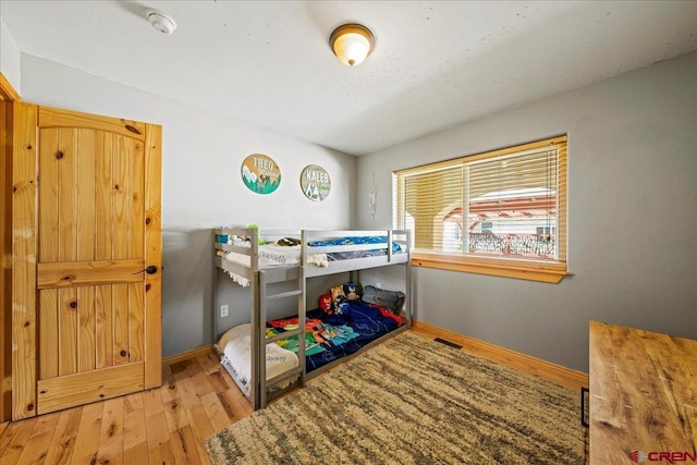 2224 American Way, Montrose, CO 81401 - bedroom featuring hardwood / wood-style floors and baseboards