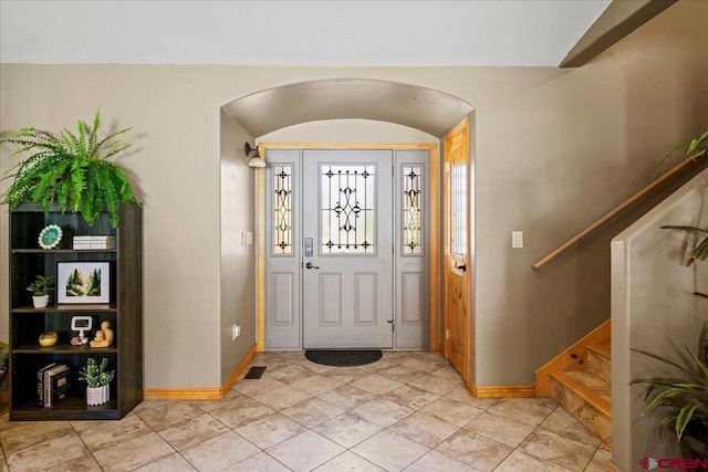 2224 American Way, Montrose, CO 81401 - foyer with arched walkways, baseboards, and stairs
