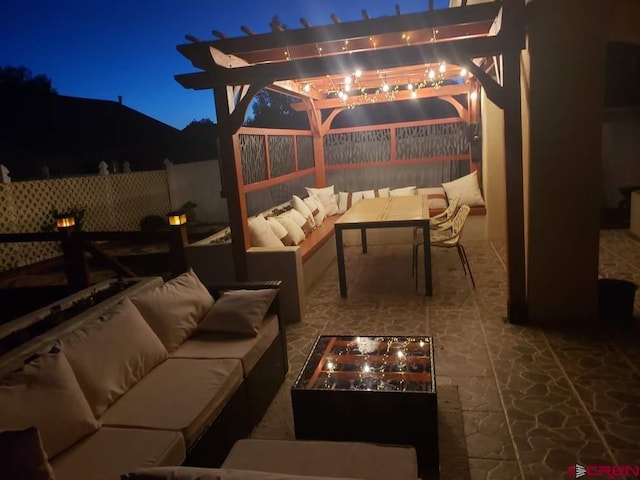 2224 American Way, Montrose, CO 81401 - patio at night with an outdoor living space with a fire pit, a fenced backyard, a pergola, and a patio