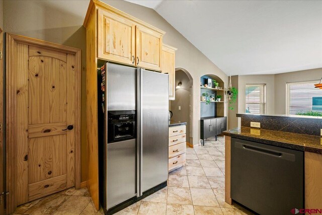 2224 American Way, Montrose, CO 81401 - kitchen featuring appliances with stainless steel finishes, lofted ceiling, tile countertops, light brown cabinetry, and built in shelves