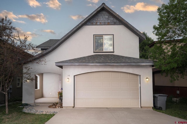 416 Amy Way, Ridgway, CO 81432 - view of front of property with concrete driveway, stucco siding, a shingled roof, and an attached garage