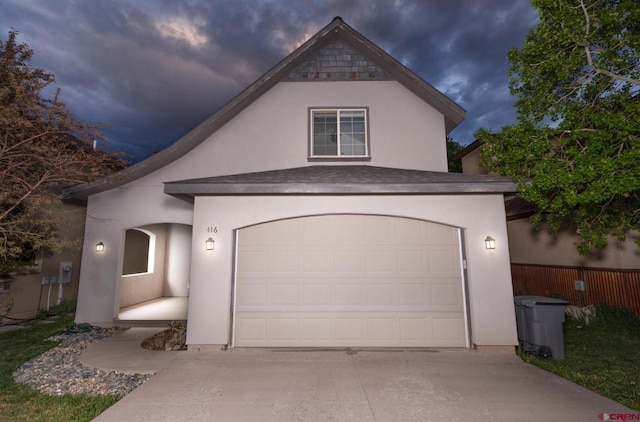 416 Amy Way, Ridgway, CO 81432 - view of front facade featuring concrete driveway, a garage, and stucco siding