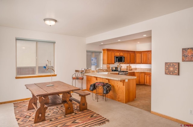 416 Amy Way, Ridgway, CO 81432 - dining space with light colored carpet, baseboards, and recessed lighting