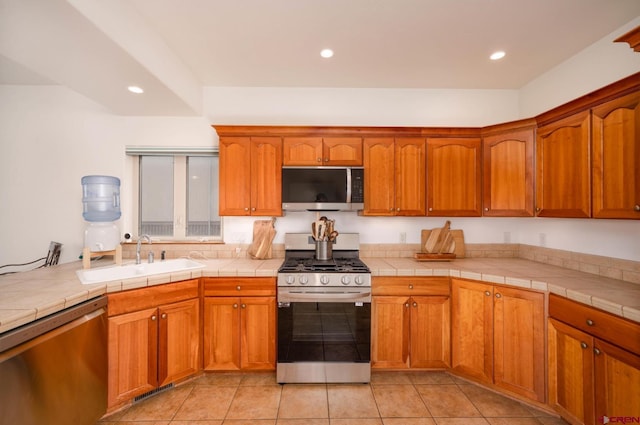 416 Amy Way, Ridgway, CO 81432 - kitchen featuring appliances with stainless steel finishes, a sink, recessed lighting, and brown cabinetry