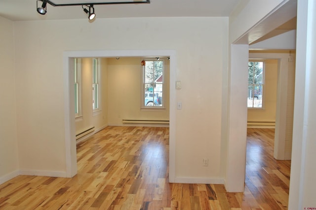418 Elk Ave, Crested Butte, CO 81224 - empty room with a baseboard heating unit and healthy amount of natural light