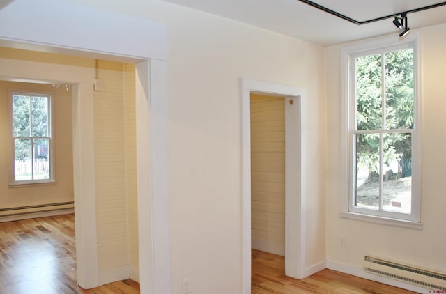 418 Elk Ave, Crested Butte, CO 81224 - spare room featuring baseboard heating, light wood-style flooring, and baseboards