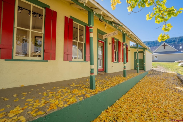 418 Elk Ave, Crested Butte, CO 81224 - view of home's exterior with stucco siding and a mountain view