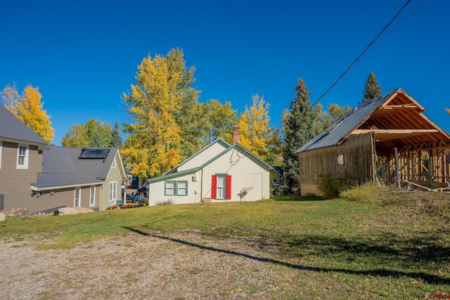 418 Elk Ave, Crested Butte, CO 81224 - view of green lawn featuring an outdoor structure