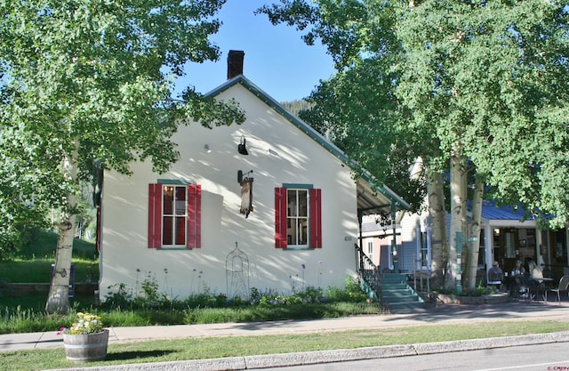 418 Elk Ave, Crested Butte, CO 81224 - view of side of property featuring a chimney and stairway