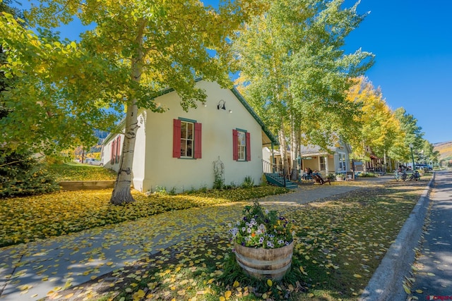 418 Elk Ave, Crested Butte, CO 81224 - view of property exterior with stucco siding