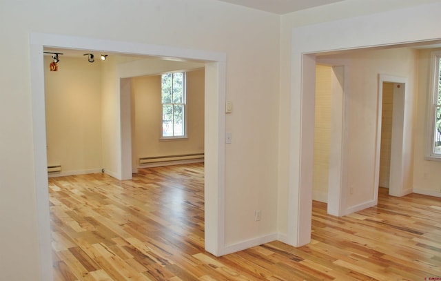 418 Elk Ave, Crested Butte, CO 81224 - spare room with a baseboard radiator, light wood finished floors, and baseboards