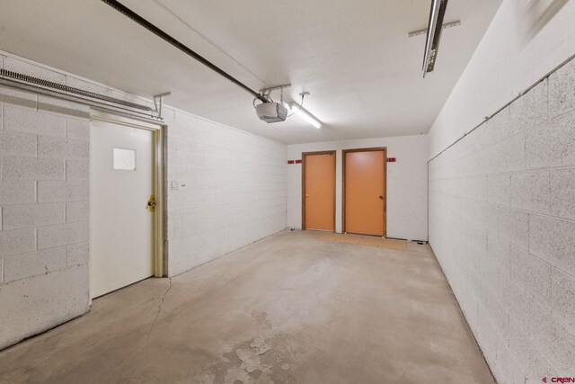 15 Marcellina Ln # 120, Mount Crested Butte, CO 81225 - garage with concrete block wall and a garage door opener