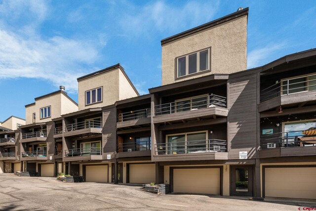15 Marcellina Ln # 120, Mount Crested Butte, CO 81225 - view of apartment building / complex featuring an attached garage