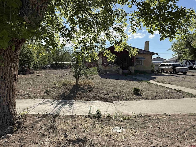 840 Hastings St, Delta, CO 81416 - view of side of home with a chimney