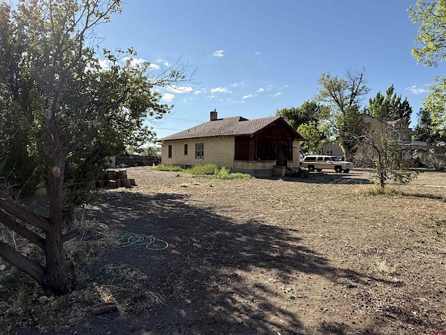 840 Hastings St, Delta, CO 81416 - view of property exterior with a chimney
