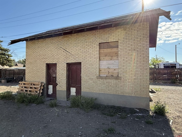 840 Hastings St, Delta, CO 81416 - view of side of property with brick siding