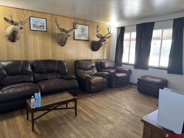 1010 N Dove St, Dove Creek, CO 81324 - living area featuring wood finished floors and wood walls