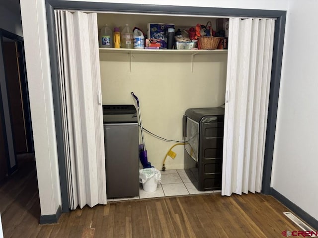 1010 N Dove St, Dove Creek, CO 81324 - laundry area with washer / clothes dryer, wood finished floors, and baseboards