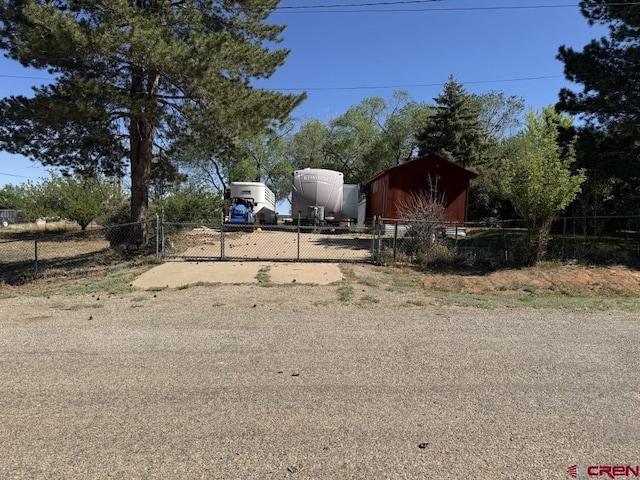 1010 N Dove St, Dove Creek, CO 81324 - view of yard with a gate and an outbuilding