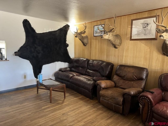 1010 N Dove St, Dove Creek, CO 81324 - living room featuring wood finished floors and wood walls