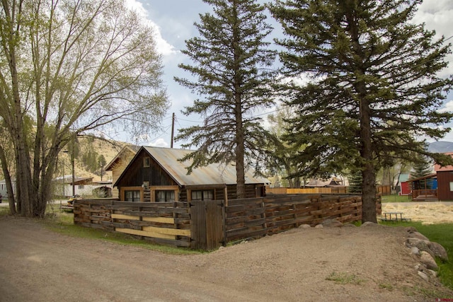 103 W 10 1/2 St, Creede, CO 81130 - view of front of home featuring log siding and metal roof