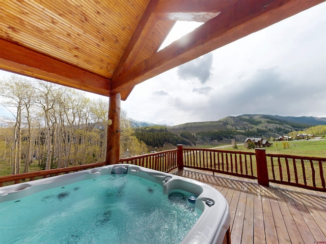 88 Castle Rock Ct, Crested Butte, CO 81224 - wooden deck with a mountain view and a hot tub