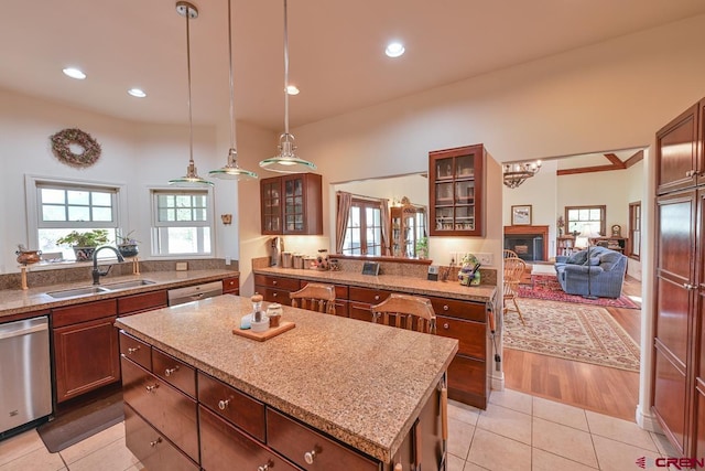 101 E Silver Sage Dr, Crested Butte, CO 81224 - kitchen featuring a sink, a kitchen island, dishwasher, plenty of natural light, and recessed lighting