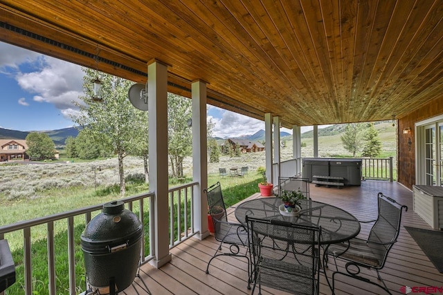 101 E Silver Sage Dr, Crested Butte, CO 81224 - wooden terrace featuring a mountain view, outdoor dining space, and a grill