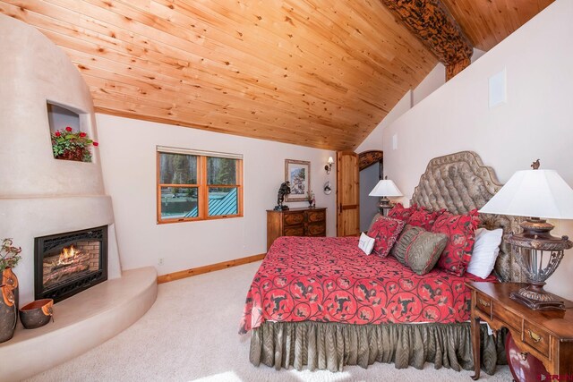 536 Journeys End Rd, Crested Butte, CO 81224 - bedroom with carpet floors, wooden ceiling, a warm lit fireplace, and baseboards