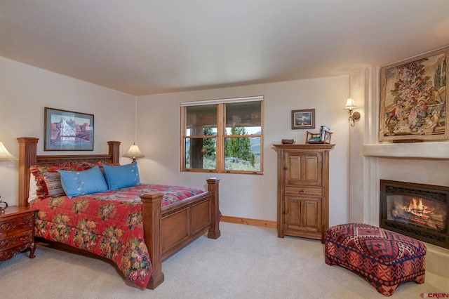 536 Journeys End Rd, Crested Butte, CO 81224 - carpeted bedroom with a glass covered fireplace and baseboards