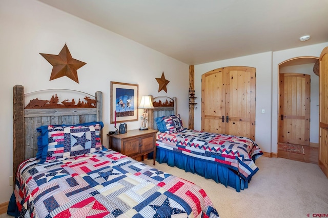 536 Journeys End Rd, Crested Butte, CO 81224 - bedroom featuring carpet and arched walkways