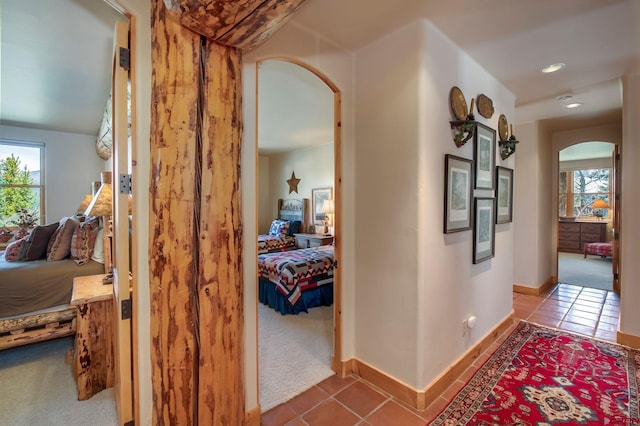 536 Journeys End Rd, Crested Butte, CO 81224 - hall with arched walkways, plenty of natural light, tile patterned floors, and recessed lighting