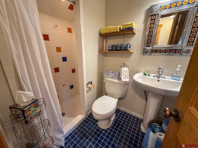 414 Maroon Ave, Crested Butte, CO 81224 - full bath with toilet, a shower stall, tile patterned floors, a sink, and baseboards