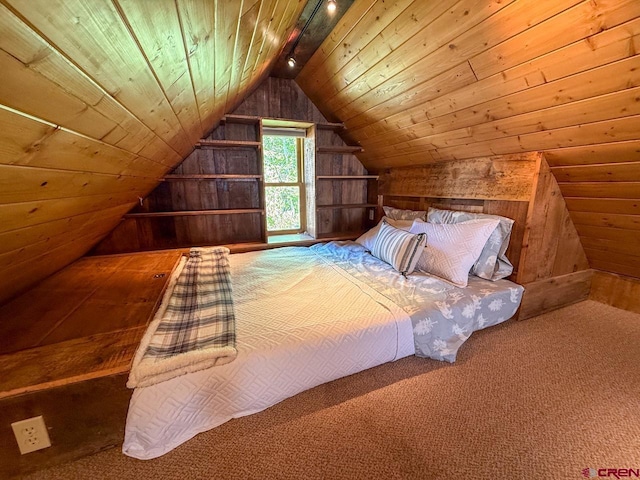 414 Maroon Ave, Crested Butte, CO 81224 - carpeted bedroom with wooden walls, lofted ceiling, wooden ceiling, and track lighting
