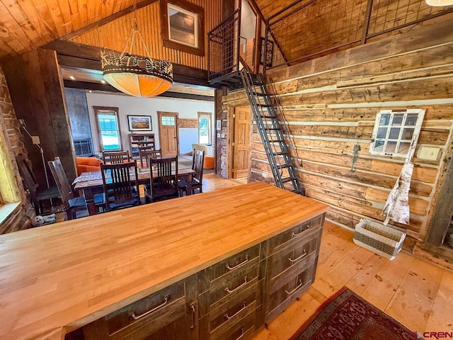 414 Maroon Ave, Crested Butte, CO 81224 - dining room featuring high vaulted ceiling, wood walls, hardwood / wood-style flooring, and wooden ceiling