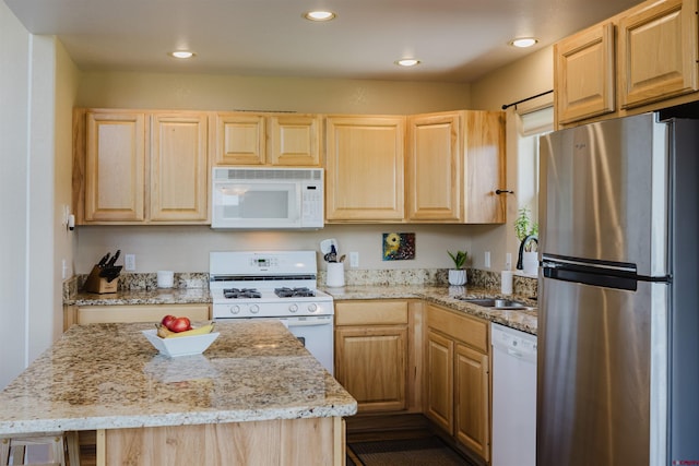 311 Falcon Dr, Pagosa Springs, CO 81147 - kitchen with white appliances, light brown cabinetry, a sink, light stone counters, and recessed lighting