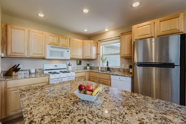 311 Falcon Dr, Pagosa Springs, CO 81147 - kitchen featuring white appliances, light brown cabinets, a sink, light stone countertops, and recessed lighting