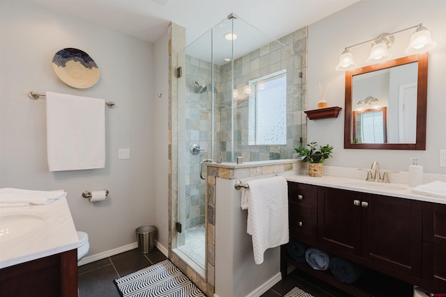 311 Falcon Dr, Pagosa Springs, CO 81147 - bathroom featuring vanity, a shower stall, tile patterned flooring, and baseboards