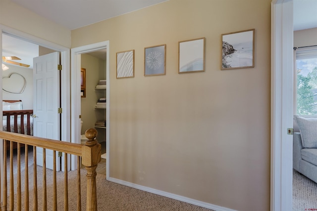 311 Falcon Dr, Pagosa Springs, CO 81147 - hall with carpet floors, baseboards, and an upstairs landing
