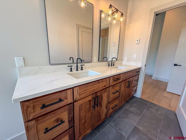 470 Meadow Dr, Crested Butte, CO 81224 - full bathroom featuring double vanity, tile patterned flooring, and baseboards