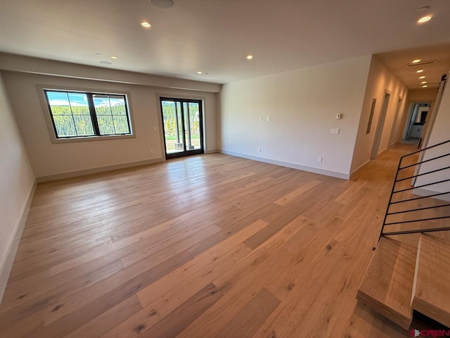 470 Meadow Dr, Crested Butte, CO 81224 - empty room featuring light wood-style flooring, recessed lighting, baseboards, and stairway