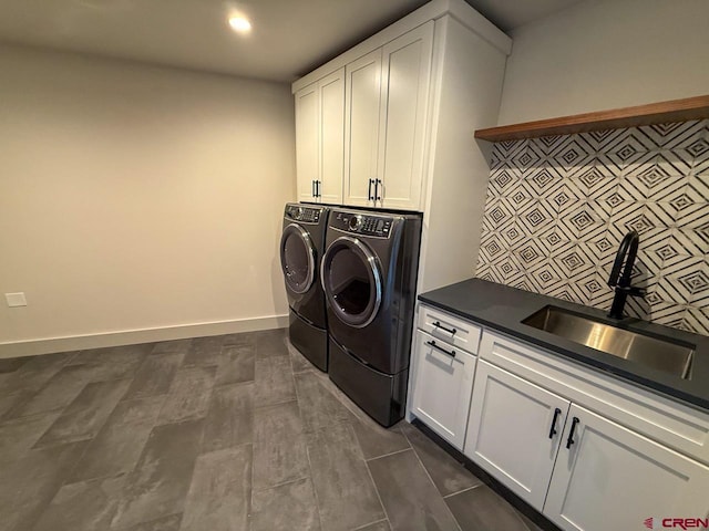 470 Meadow Dr, Crested Butte, CO 81224 - washroom with cabinet space, washer and clothes dryer, and baseboards