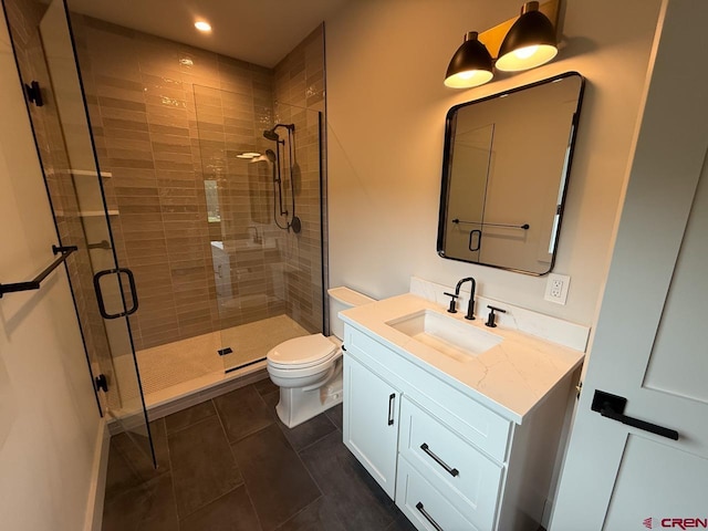 470 Meadow Dr, Crested Butte, CO 81224 - bathroom featuring vanity, toilet, a stall shower, tile patterned floors, and recessed lighting