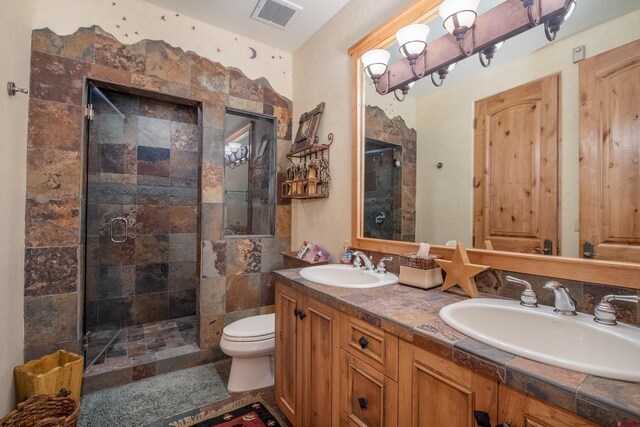 42 Gold Link Dr, Mount Crested Butte, CO 81225 - bathroom with a stall shower, toilet, and double vanity