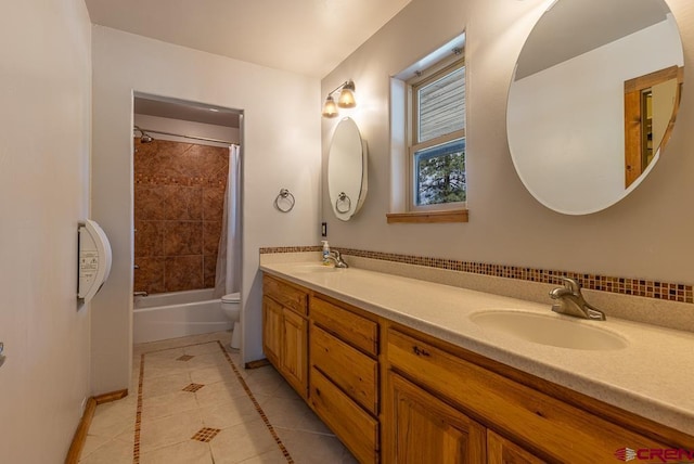 30 Stagecoach Rd, Bayfield, CO 81122 - bathroom featuring tile patterned flooring, double vanity, toilet, shower / bath combo, and baseboards