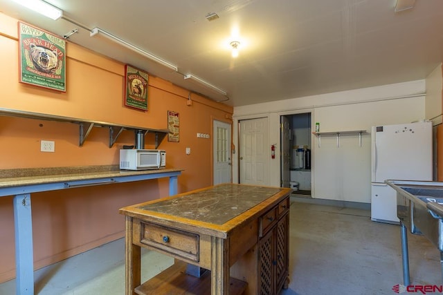 30 Stagecoach Rd, Bayfield, CO 81122 - kitchen with white appliances and finished concrete flooring