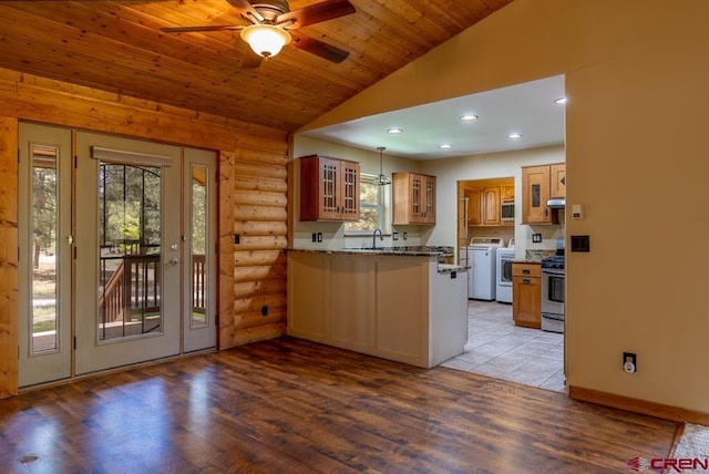30 Stagecoach Rd, Bayfield, CO 81122 - kitchen featuring lofted ceiling, a peninsula, glass insert cabinets, a ceiling fan, and light wood-style flooring